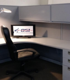 white workstation with black chair and white lamp