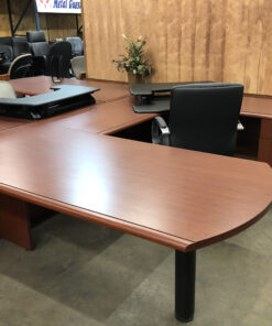 steelecase peninsula desk with black chair and folder organizer