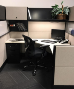 white and black tiled workstation with overhead cabinet and shelf, black chair and black desktop